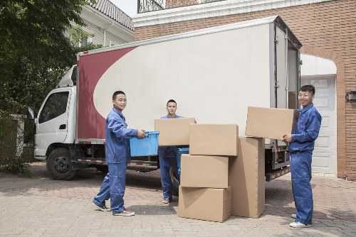 Loading furniture and boxes into a van for an Enfield removal job