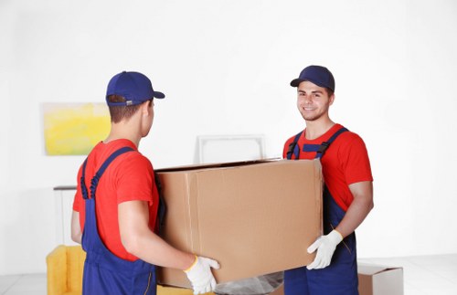 Enfield movers carefully loading household items for a local relocation