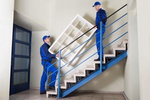 Moving team planning a home removal in an Enfield residential street