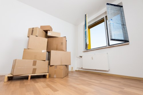 Experienced movers in Enfield preparing furniture for a smooth transition