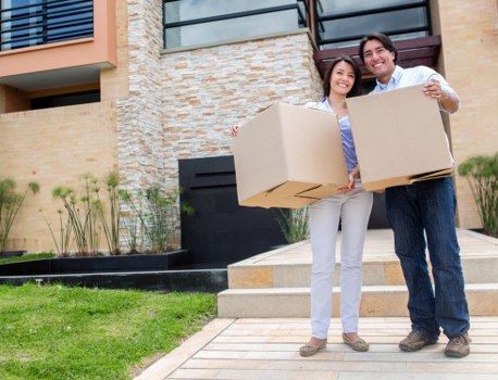 Quote checklist beside a townhouse move in Enfield